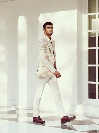 Elevate your style game with our impeccably tailored linen-silk-wool check jacket, where comfort meets sophistication.