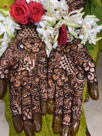 The same personalized design, adorned with fresh flowers for the ceremony.