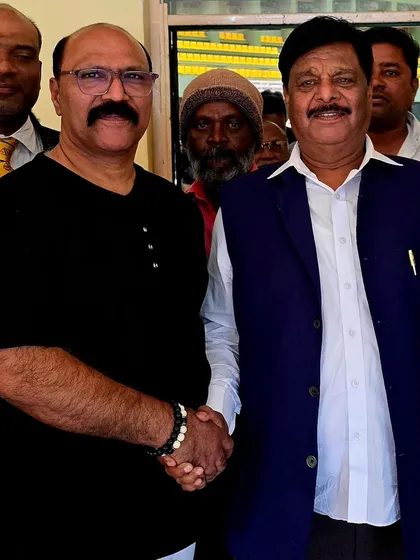 Meeting Dr. H.C. Mahadevappa, a Karnataka state minister, at a National Level Karate Tournament in Mysore. We value the support of community leaders.