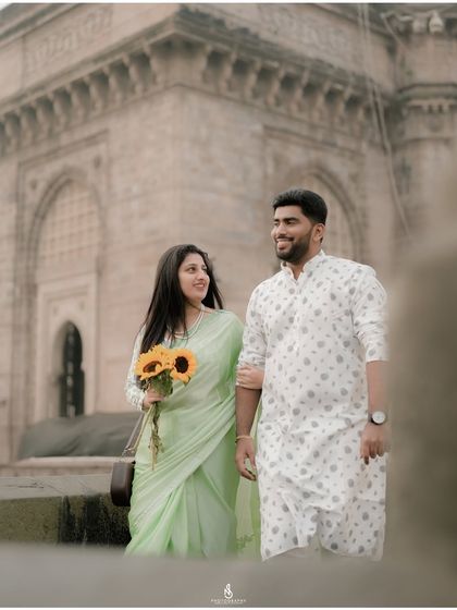 A classic walking portrait, capturing their elegant stride and happy connection.