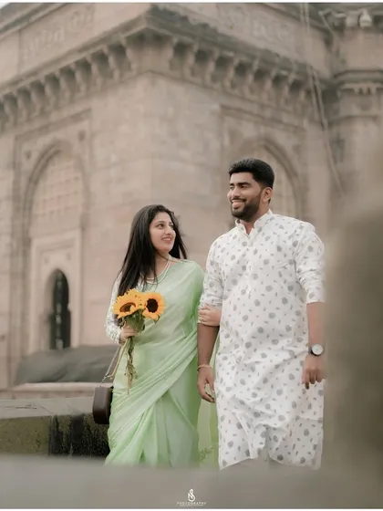 A classic walking portrait, capturing their elegant stride and happy connection.