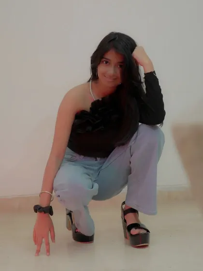 A low-angle shot of the model in a casual outfit. This pose is great for fashion lookbooks and adds variety to a portfolio.