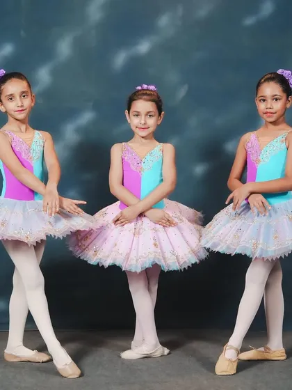 Our ballerinas in their vibrant costumes for 'Waltz of Hours.' These photos capture the poised and polished look of our young performers before they take the stage.