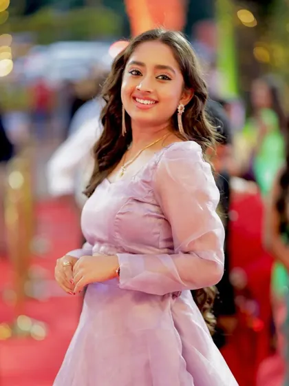 A close-up of Ankitha Jayarama's happy expression, radiating positivity.