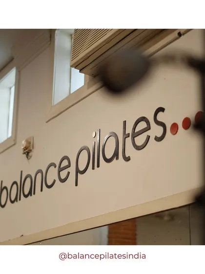 A close-up of our studio's sign. This is the space where you come to find your balance.