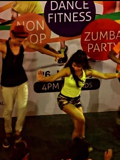 On stage during a 'Non-Stop Zumba Party'. This image captures the high-energy atmosphere of our public dance fitness events.