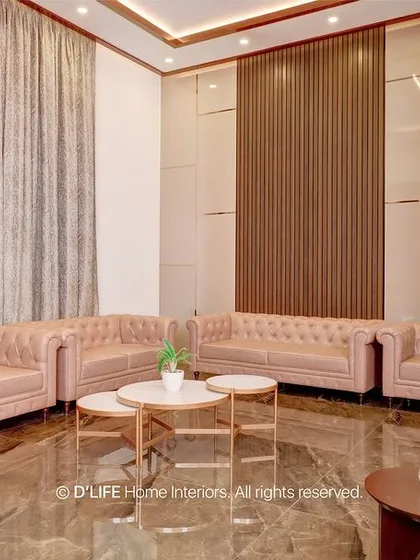 Another angle of the formal living room, showing the full set of tufted sofas and the beautiful wall paneling that adds texture and sophistication.