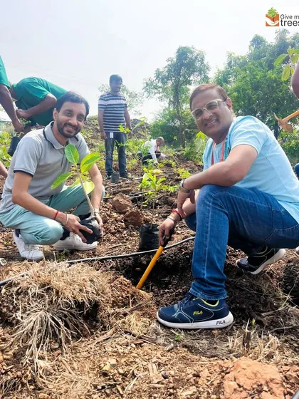 EXL employees getting started at the Pune Prayagdham site. We ensure every volunteer understands the importance of proper planting techniques for the sapling's long-term health.
