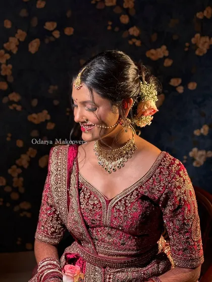 Another angle of this stunning bride, capturing her radiant smile. The makeup is kept soft and romantic to match the overall vibe of her wedding look.