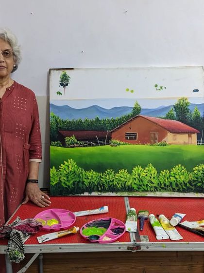 The artist with her finished landscape. Harinder ma'am's acrylic painting of a country house is ready to be framed and admired.