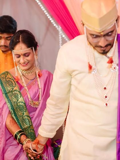 The couple holding hands as they walk together, symbolizing the start of their new journey.