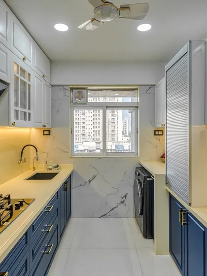 A beautiful parallel kitchen in a classic blue and white PU finish. This design proves that modular kitchens can be both timeless and full of character.