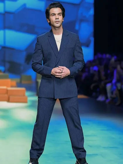 Actor Rajkummar Rao looking sharp and stylish in a pinstripe suit on the runway. This shows my versatility in capturing men's fashion as well.