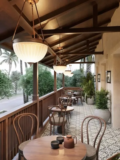 We designed this serene veranda to be a bridge between the café's interior and the natural world outside. The combination of warm wood, patterned tiles, and soft lighting creates a tranquil setting for guests to relax and enjoy the view.