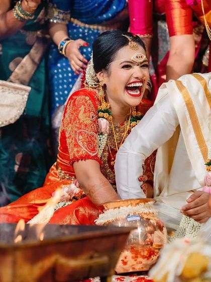 A moment of pure, uninhibited laughter from the bride and groom during their wedding ceremony. These are the candid shots we love to capture.