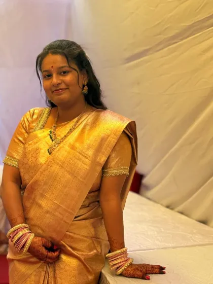 A slightly different pose of the same beautiful bride, showcasing her elegant look for her special day.