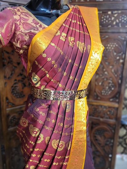 A close-up of the perfectly pleated pallu on the mannequin. In my classes, I emphasize the importance of neatness and precision in every step.