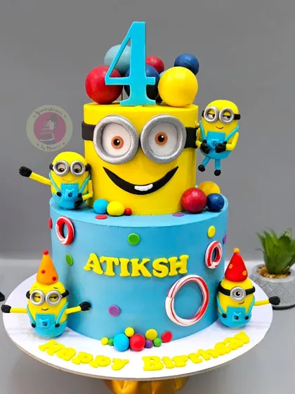 This vibrant two-tier Minions cake is pure happiness. With multiple handcrafted, playful Minion figurines, it’s a perfect example of how we bring beloved characters to life for a child's special day.