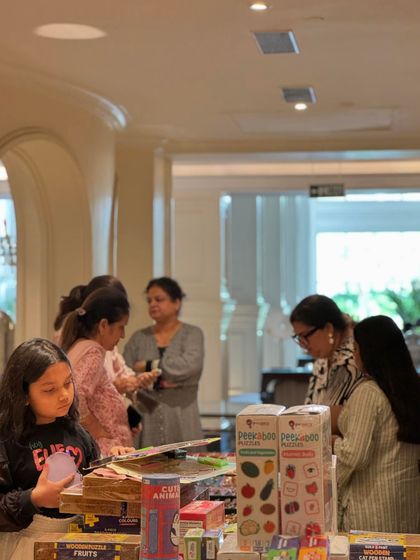 Young shoppers are captivated by the fun and engaging products available at the kids' section of the exhibition.