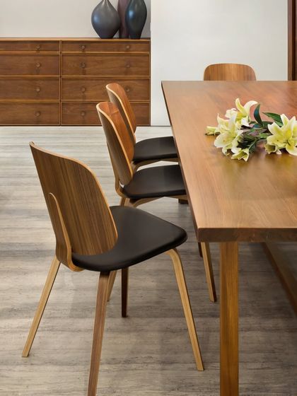 A detail shot of the dining chairs in the Limestone Residence, showcasing their curved wooden backs and simple, elegant form. This is an example of our belief in the beauty of well-crafted, functional objects.