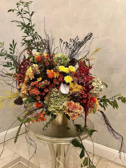 The full view of this autumnal, poetry-inspired arrangement. The wild, sprawling branches and rich, earthy colours make it a truly unusual and captivating piece.