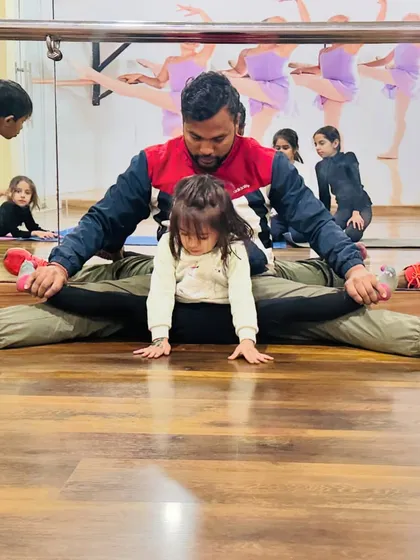 It all starts with flexibility, even for my youngest students. This little gymnast is only three years old and is already learning how to stretch correctly with my help. We make it safe and fun for them.