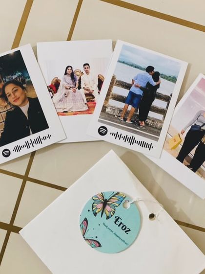 A set of Spotify polaroid prints packaged beautifully with my brand tag, ready to be sent to a client.