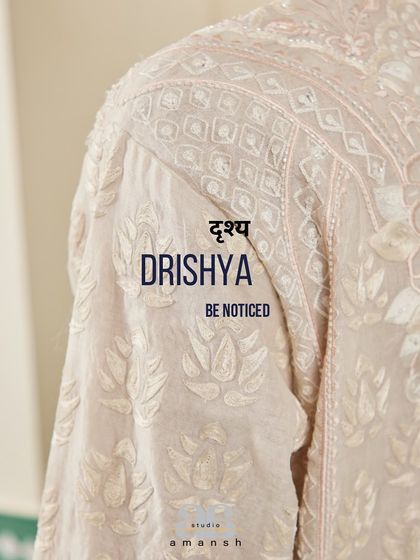 A detail of the shoulder embroidery on the beige kurta, with our brand motto.