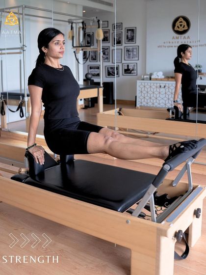 Strength and control on the Reformer. This exercise requires a strong core to keep the body stable while the legs move, demonstrating the essence of Pilates.