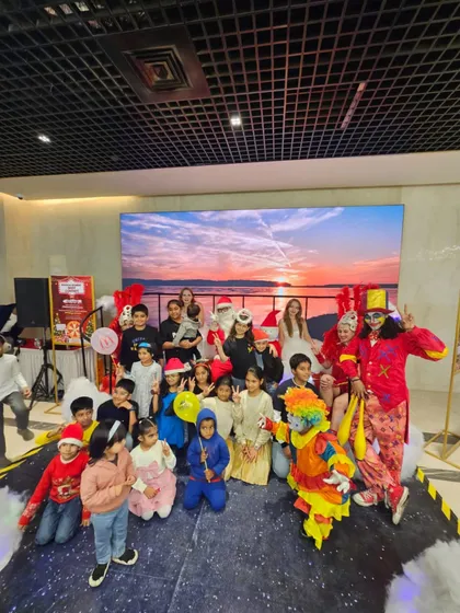 Another great shot of children and families gathering on stage with our full cast of Christmas characters. We create a friendly and approachable atmosphere, perfect for family-focused events.
