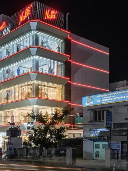 In contrast to my earth-based projects, this is the flagship Nalli store in Chennai, illuminated at night. The design transforms the building into a beacon, showcasing my capability in handling large-scale, modern commercial architecture and creating a strong brand presence in a dense urban landscape.