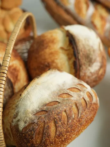 Look at the beautiful scoring on this artisan loaf, a technique we teach to control how the bread expands in the oven. Mastering this is key to creating professional looking sourdough style breads.