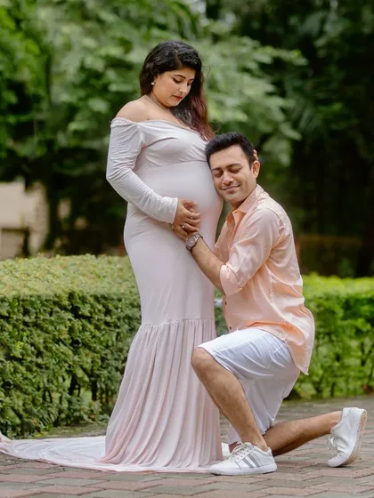 A classic maternity pose with the father-to-be listening to the baby bump. A timeless and emotional shot for any expecting family.