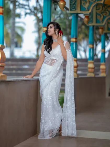 The model posing against a modern backdrop, showing the versatility of the look.