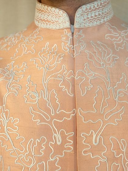 A close-up of the fine dori embroidery, a testament to the skill and artistry that goes into every Manhar creation.