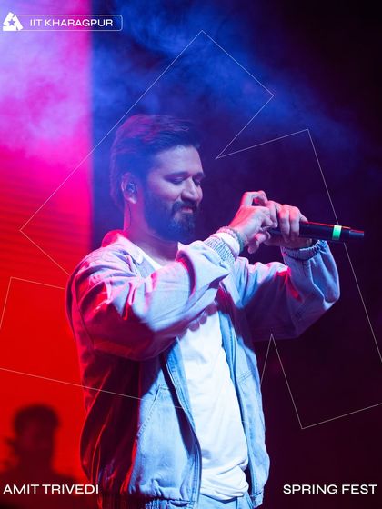A portrait of Amit Trivedi performing at Spring Fest, with our custom geometric lighting design framing him.