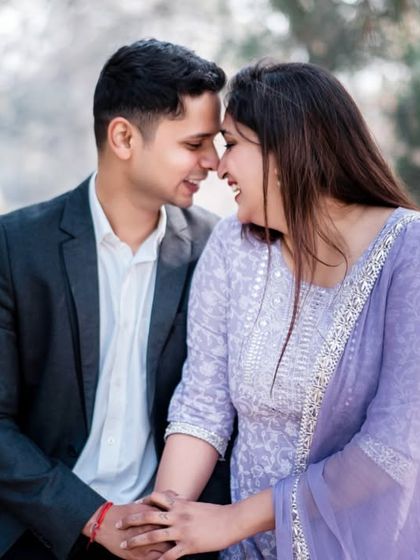A sweet and simple moment between a couple in a park. The natural setting and their gentle interaction make for a timeless and heartfelt pre-wedding portrait.