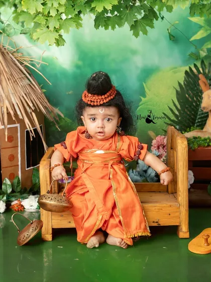 Dressed in saffron robes, this little one embodies the spirit of Lord Ram during his exile. Every detail is carefully chosen to honor the story.