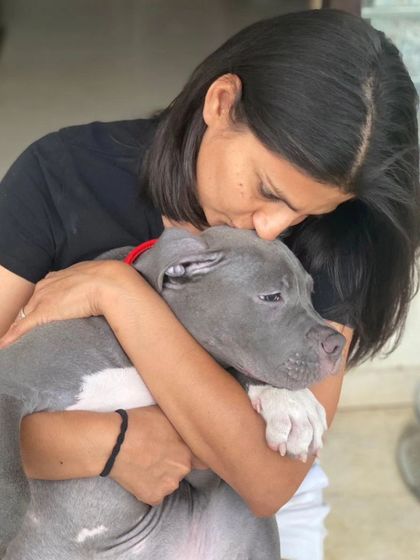 A kiss for a sleepy puppy. These moments of pure affection from our founder Vizal show the deep love and care that is at the core of our service.