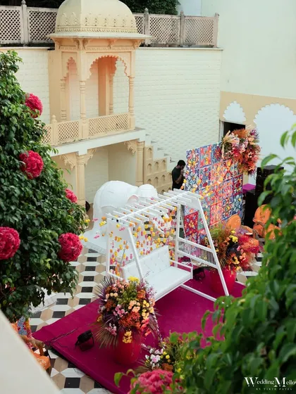A beautiful floral swing setup for the Mehendi ceremony. This provides a perfect spot for the bride to sit comfortably and for guests to take photos.