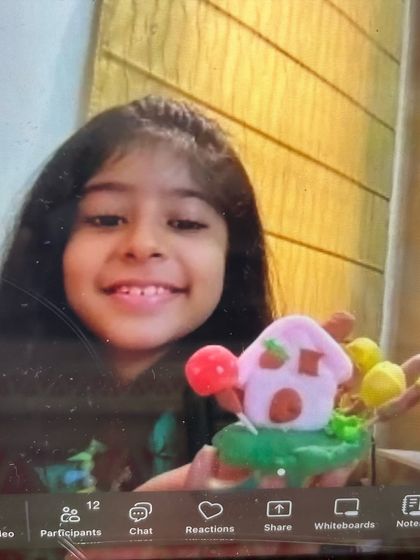 Another proud student from our online clay workshop, showing off her cute mushroom house.