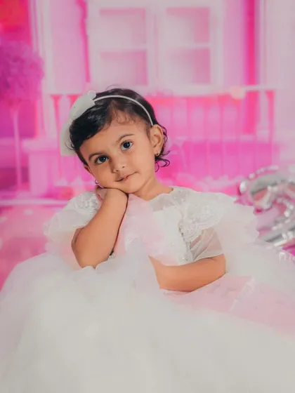 A sweet, thoughtful pose from our little Barbie. Close-up shots like this capture the innocent and curious nature of a two-year-old.