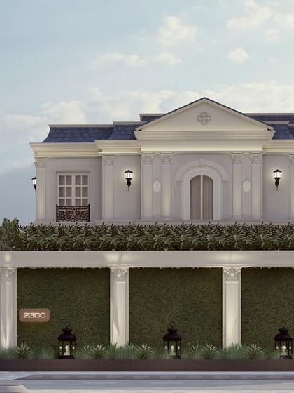 "The Clarence," a home designed for two brothers, presents a unified classical facade to the street. The soft ivory tones and symmetrical design create a sense of calm, moonlit elegance.
