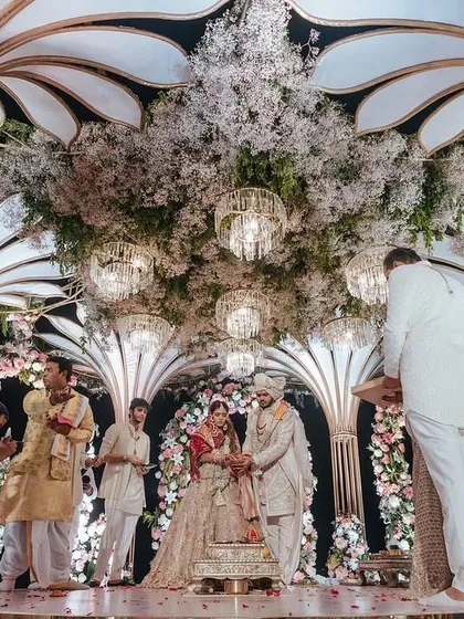 A beautiful moment from Yasha and Rahil's ceremony inside the intricately designed mandap. The baby's breath ceiling and soft lighting created a dreamy and intimate atmosphere.