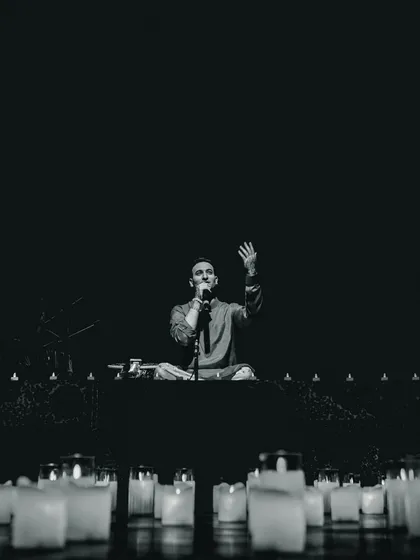 Leading the audience in a moment of shared breath and intention in Ahmedabad. These concerts are interactive; it's not just about you listening to me, but about us creating a collective energy of peace and mindfulness together.