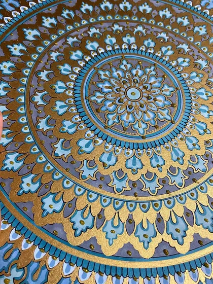 This intricate mandala, detailed with shades of blue and shimmering gold paint, is one of my favorite creations. I use high-quality acrylic sheets to ensure the colors are vibrant and the details are crisp, making it a perfect statement piece for any room.
