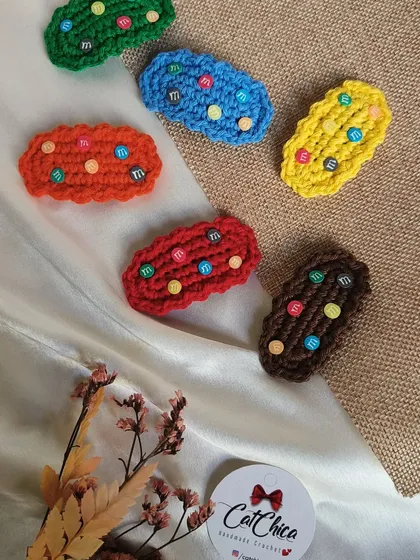 Our 'Girly Gems' clips are so much fun! They are crocheted in bright colors and decorated with beads that look like little candies.
