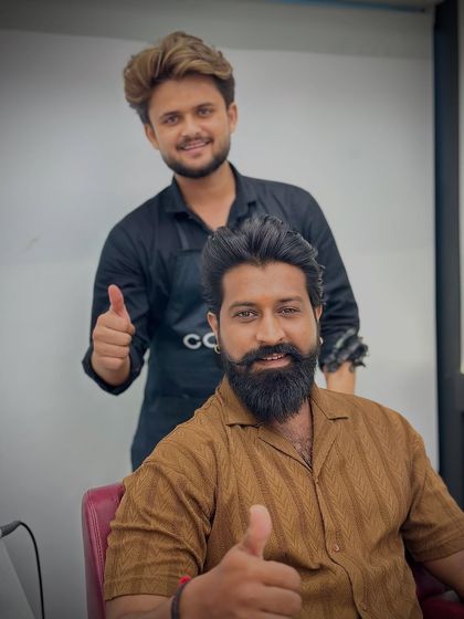 Two thumbs up from a happy client and his stylist. We love seeing our clients leave with a smile.