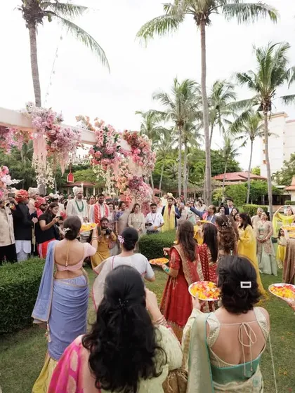 The beginning of a beautiful entry. The bride's family awaits the groom, perfectly positioned for a choreographed welcome at this stunning destination wedding.