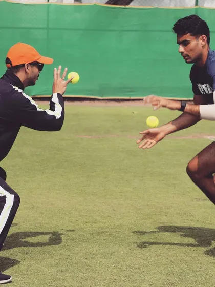 Eyes on the ball. Using reaction drills to improve an athlete's hand-eye coordination and reflexes. This type of training sharpens the specific skills needed for high-level tennis.
